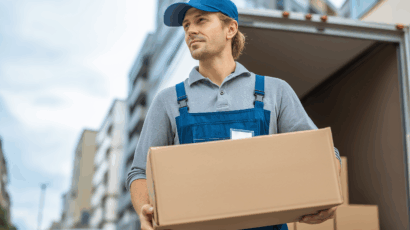 u6431158296_A_young_delivery_person_in_blue_overalls_and_a_cap__345a6623-72a9-4979-ab94-134588b005ab